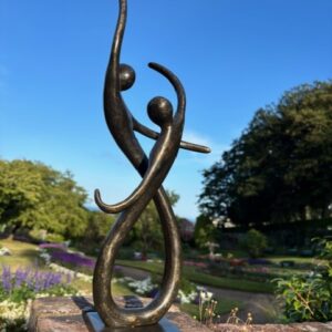 Dancing couple bronze sculpture with abstract figures in flowing modern design
