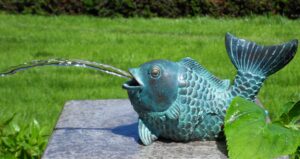 bronze koi carp fountain sculpture verdigris fish water feature spouting water from mouth for garden pond display