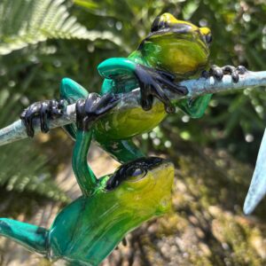 Bronze Frog Pair Green Glaze Patina On Twig MI 15 detailed portrait of the upper frog showing glossy green glaze, yellow markings and realistic climbing pose.
