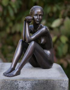 Bronze seated female nude sculpture contemplation pose dark patina figure on base