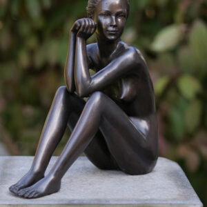 Bronze seated female nude sculpture contemplation pose dark patina figure on base