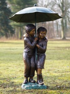 Bronze boy and girl under umbrella garden fountain sculpture with gentle water flow suitable for ponds patios and family spaces