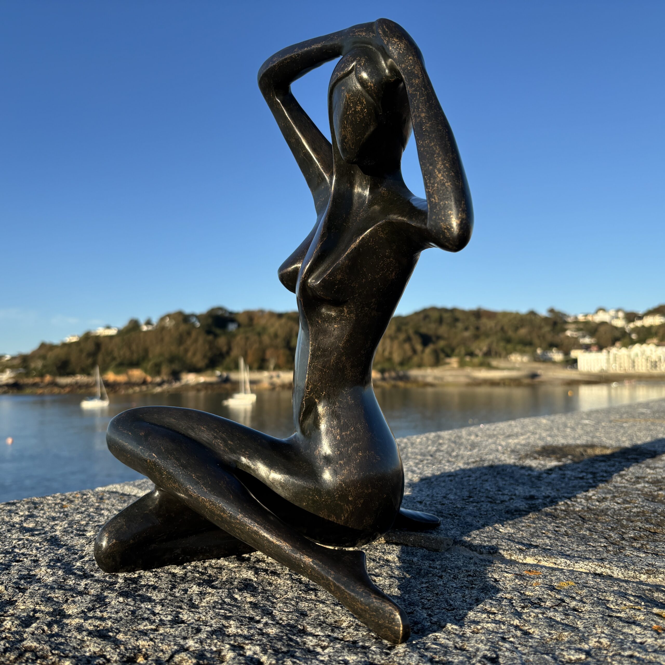 Abstract Female Nude Bronze Sculpture – Modern Seated Woman Figure rear three-quarter view highlighting the smooth sculptural curves