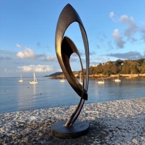 Bronze Abstract Sculpture - Spirit of Love Photographed at Havelet Bay at Sunrise.