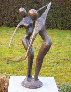Modern dancing couple bronze sculpture with smooth abstract figures and elegant flowing movement