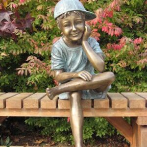 Solid Bronze Boy With Cap Sitting 1 | Avant Garden Bronzes