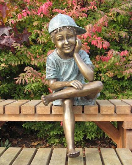 Solid Bronze Boy With Cap Sitting 1 | Avant Garden Bronzes