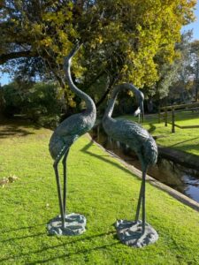 Crane bronze fountain sculpture with verdigris finish and flowing water