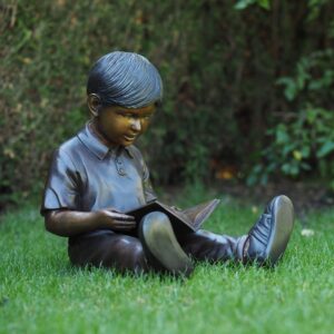 Young Boy Sitting Down Reading A Book Bronze Sculpture FIBO 58 1 | Avant Garden Bronzes