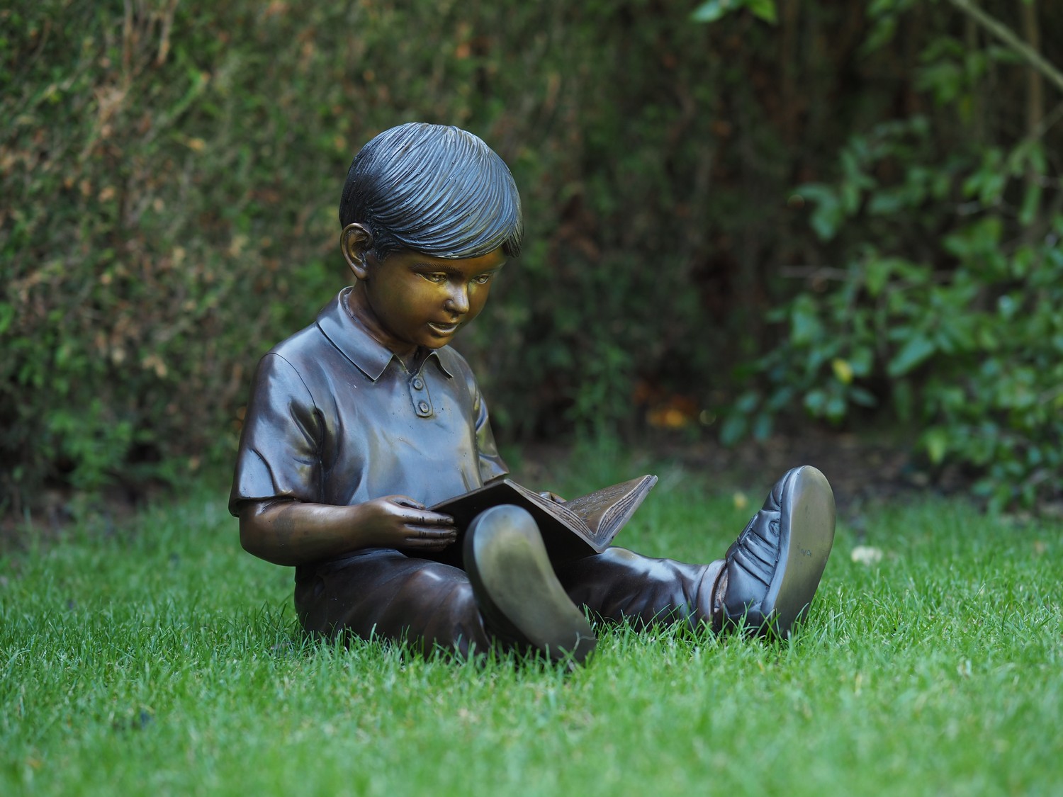 Young Boy Sitting Down Reading A Book Bronze Sculpture FIBO 58 1 | Avant Garden Bronzes