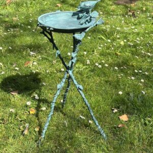 bird bath or bird feeder bronze garden sculpture tripod base verdigris decorative bird bath for garden border display on grass