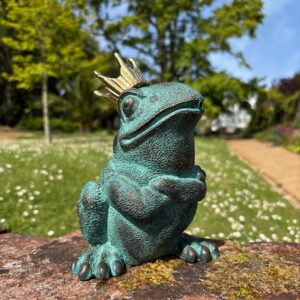 Bronze Frog King fountain sculpture with verdigris finish in sunny English garden setting