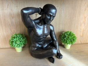 Seated male nude bronze sculpture contemplative modern figure