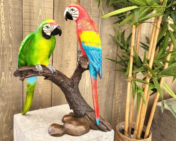 2 bronze parrots sat on a branch 3MTDA.T