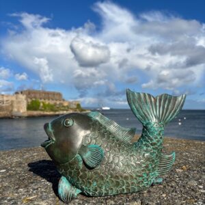 Bronze koi carp fountain water feature sculpture FO75 beside the sea in Guernsey