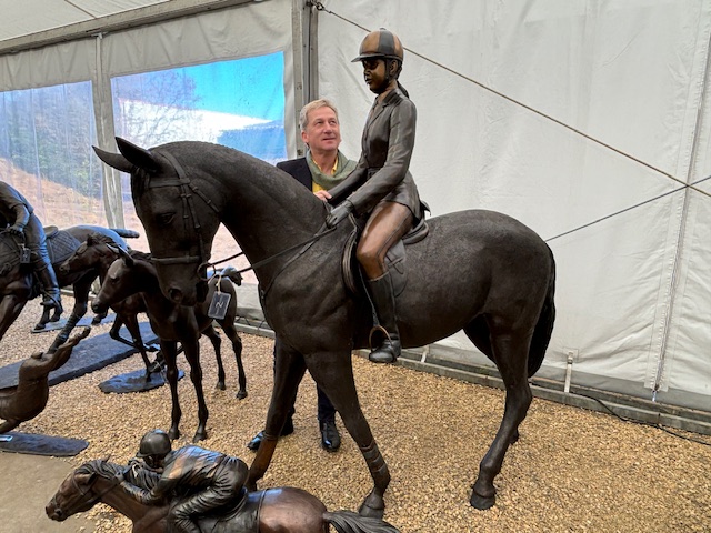 Life size dressage horse and rider bronze sculpture shown with person for scale and proportion