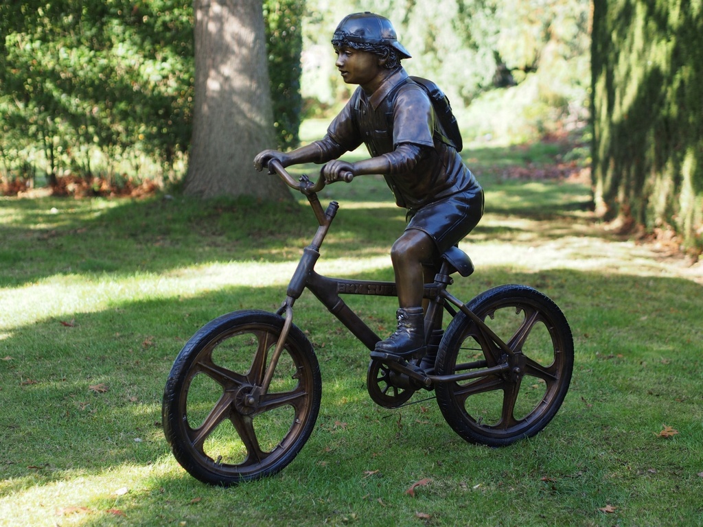 Bronze Boy Riding Bicycle In Backwards Cap Garden Sculpture FIBO 68 | Avant Garden Bronzes
