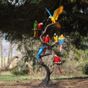 Bronze parrot flock tree sculpture with eight colourful parrots perched on tall branches