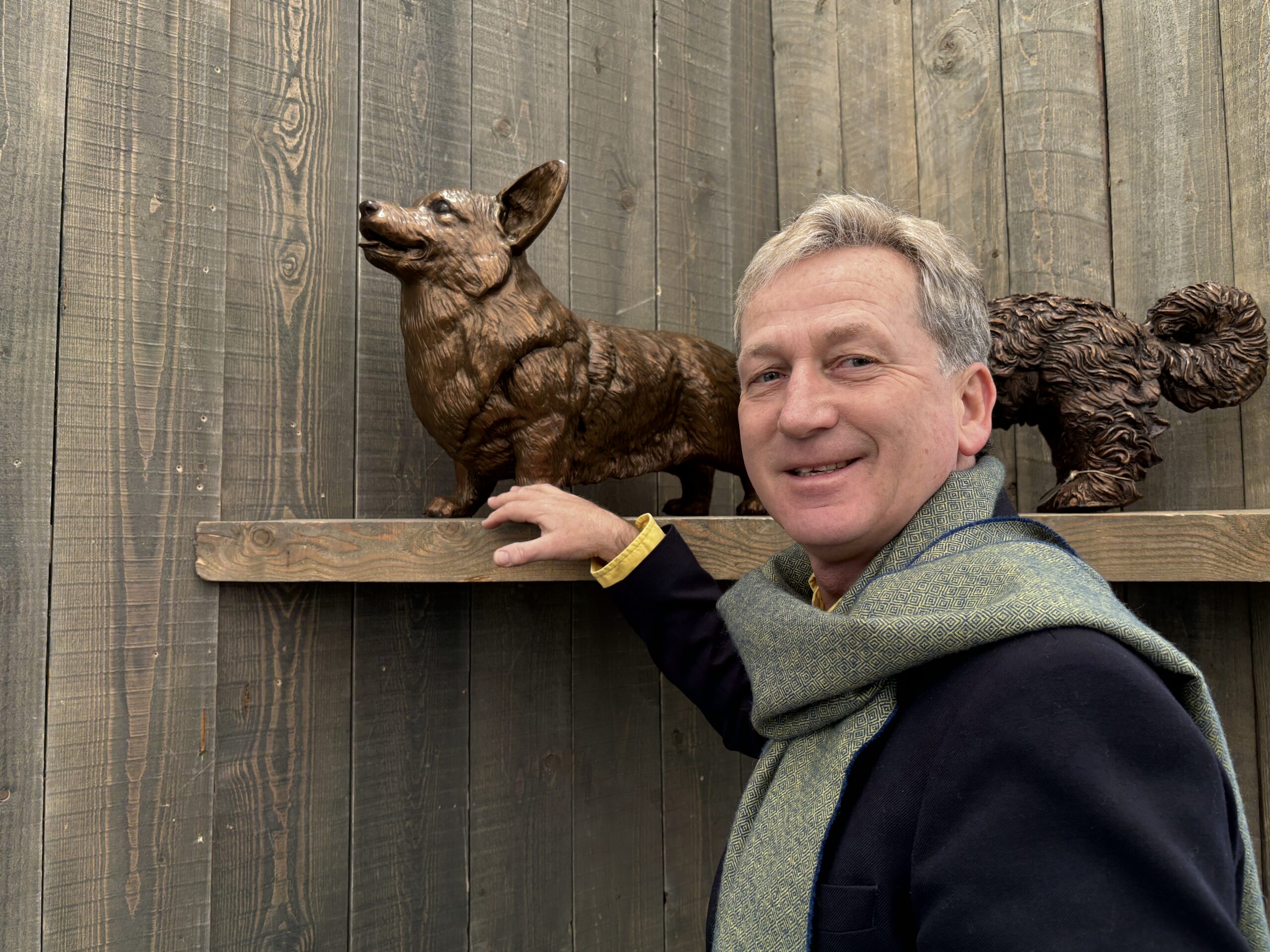Nick Martel with bronze Royal Corgi dog sculpture at Avant Garden
