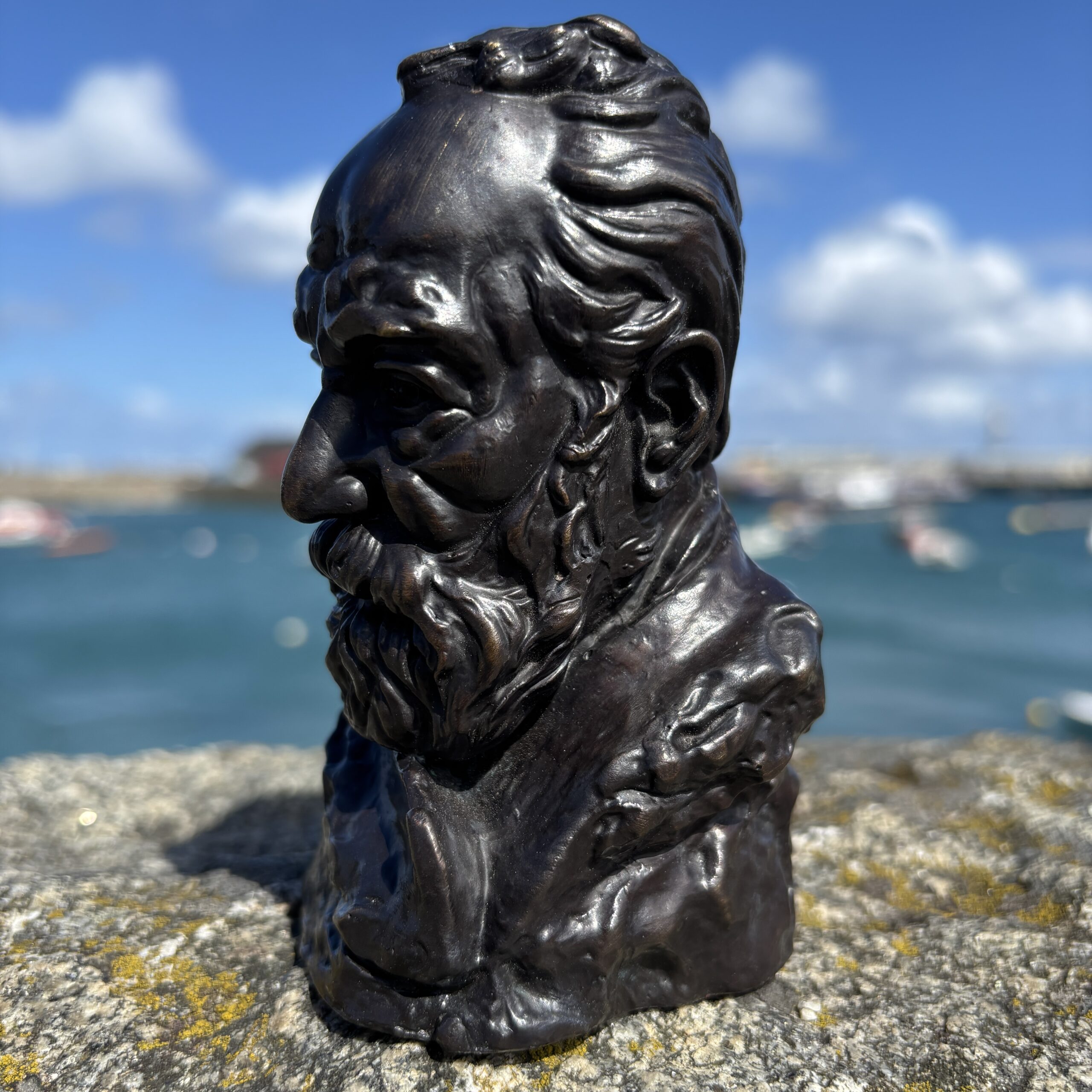 Small Victor Hugo Bronze Sculpture side detail with sea and boats in soft focus