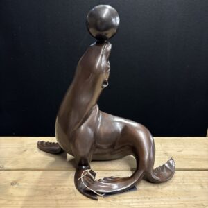Bronze Balancing Seal Fountain Sculpture FO 83 side profile with balancing ball and flowing curved tail detail