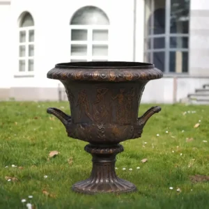 The Classical Heritage Bronze Urn Vase MESU 135 large decorative bronze garden urn with classical relief figures and ornate handles displayed on a lawn