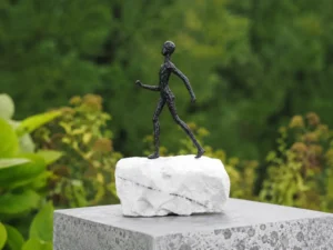 Keep Going Figure on Marble Base MO 74 contemporary bronze walking sculpture