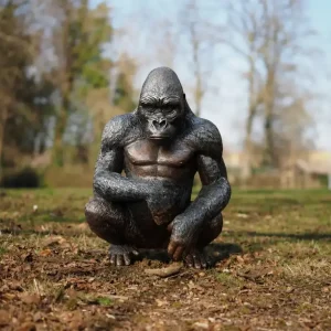The Silverback Powerful Seated Gorilla Bronze Sculpture with detailed fur and muscular physique in garden setting WI 118